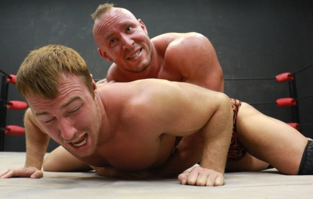 Brute bearhugs Fray on the mat