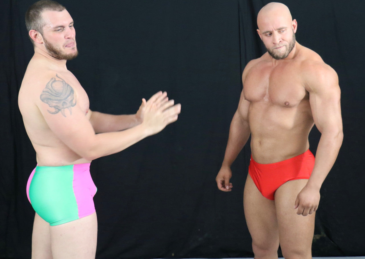 NJustice and Brute size each other up pecs arms biceps