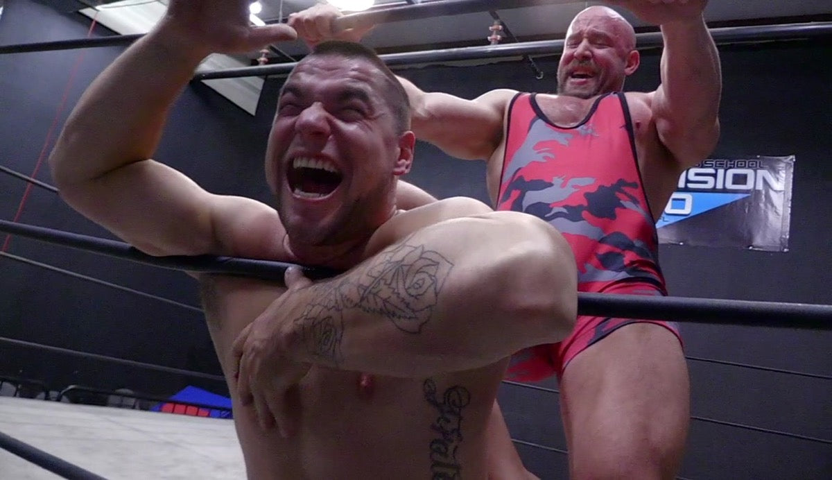 Brute pins Aspen against the ropes at Thunders Arena Wrestling. 