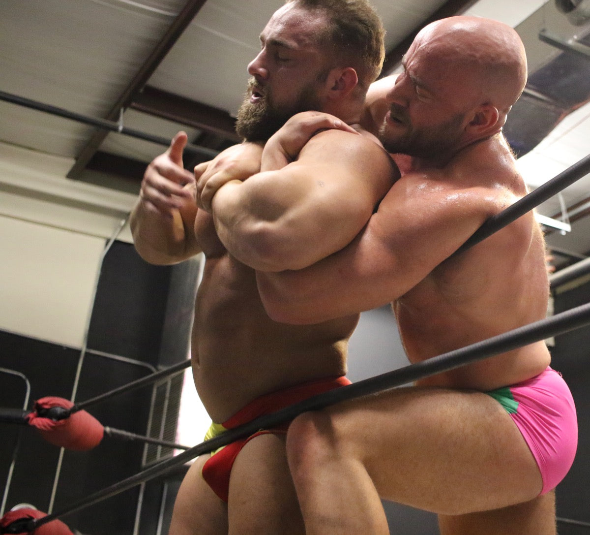 muscular guys fighting in a ring
