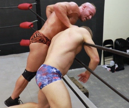 Brute chokes Viggo on the ropes back thighs