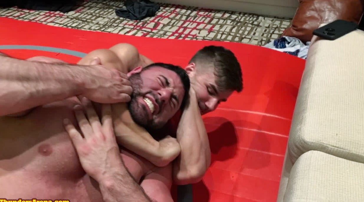 Loki puts Mercury into a sleeper at Thunders Arena Wrestling. 
