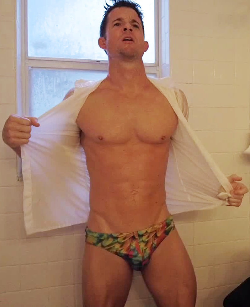 Brix taking off his shirt in the shower