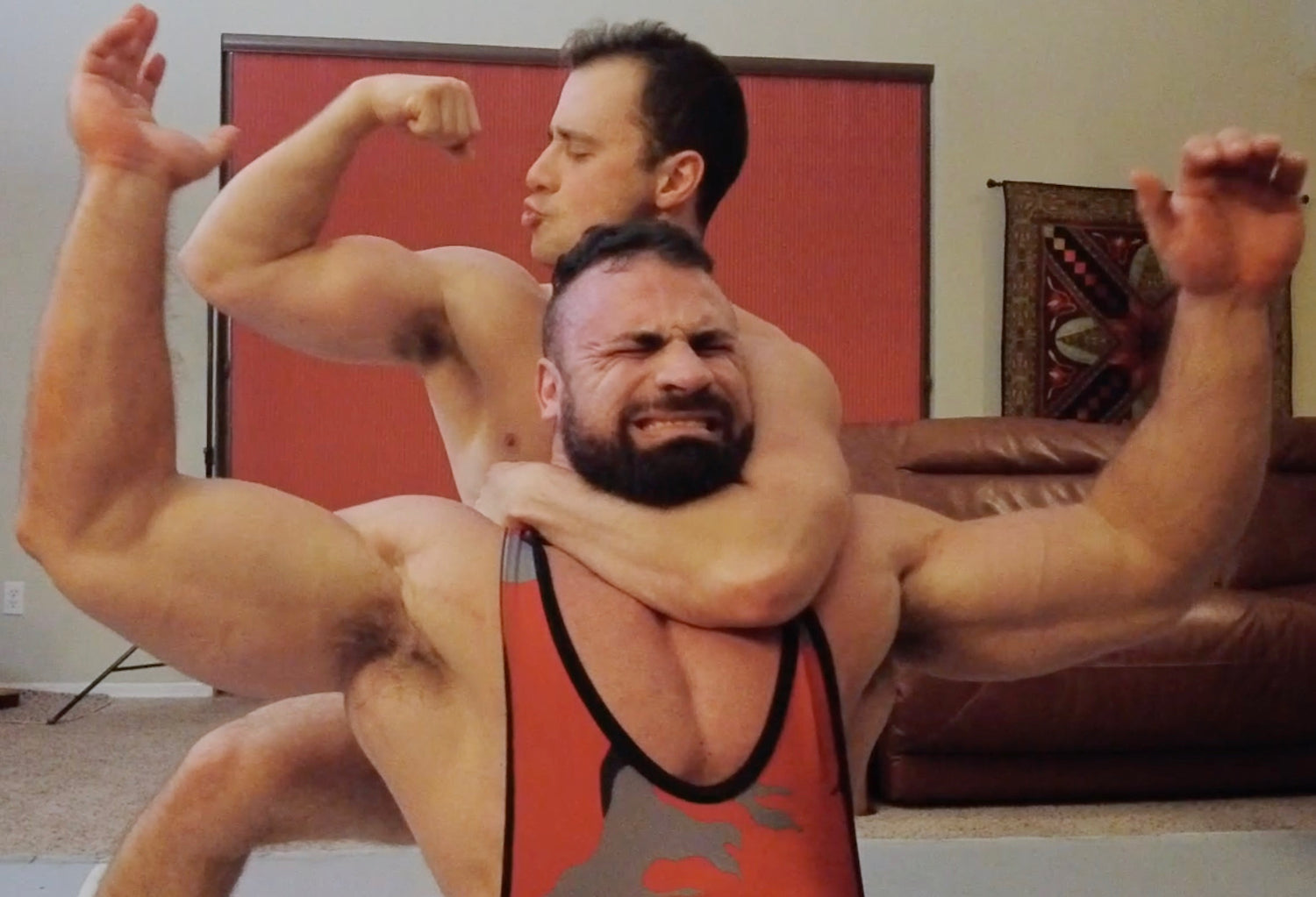 Rome double bicep flexing while being choked by Bolt