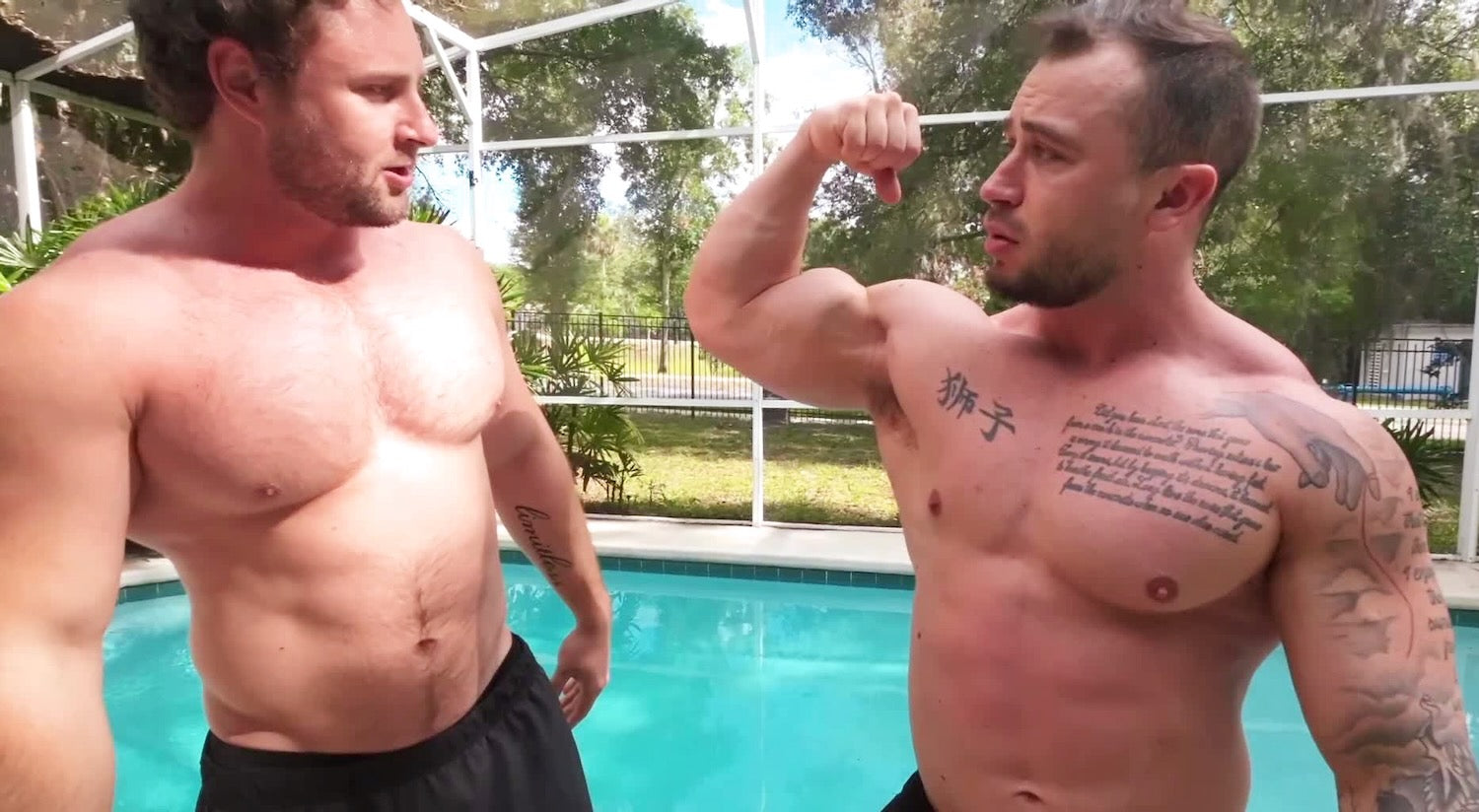 Bodybuilders flexing by pool
