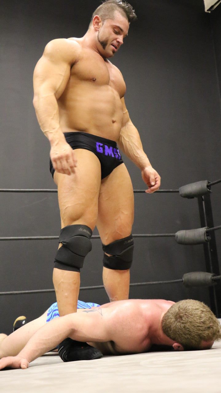 Brian Cage victory pose over Talon huge pecs abs 