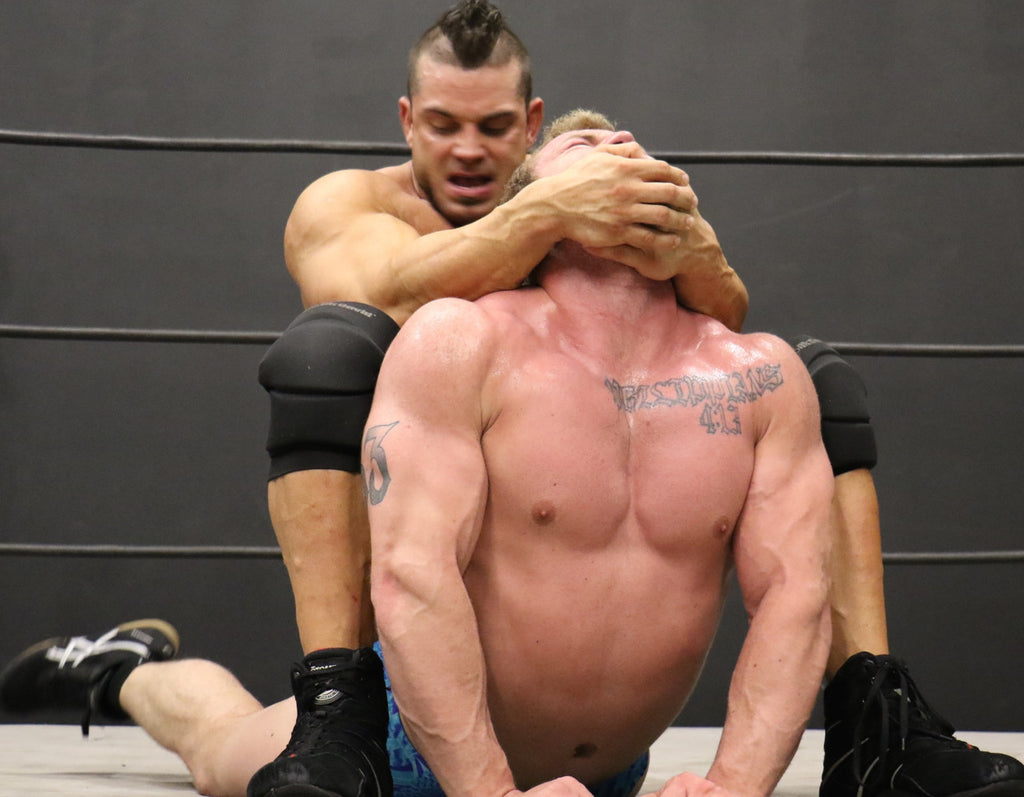 Brian Cage camel clutch on Talon biceps pecs chest