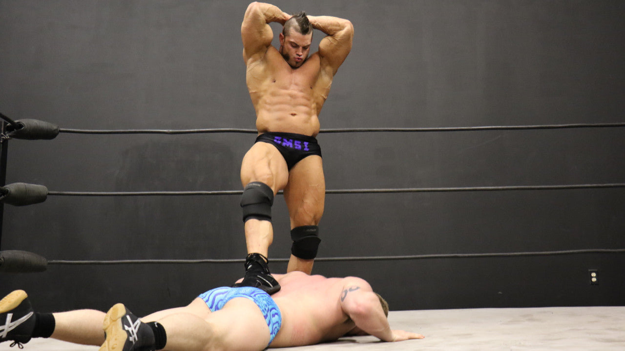 Brian Cage victory pose double arm flex huge biceps