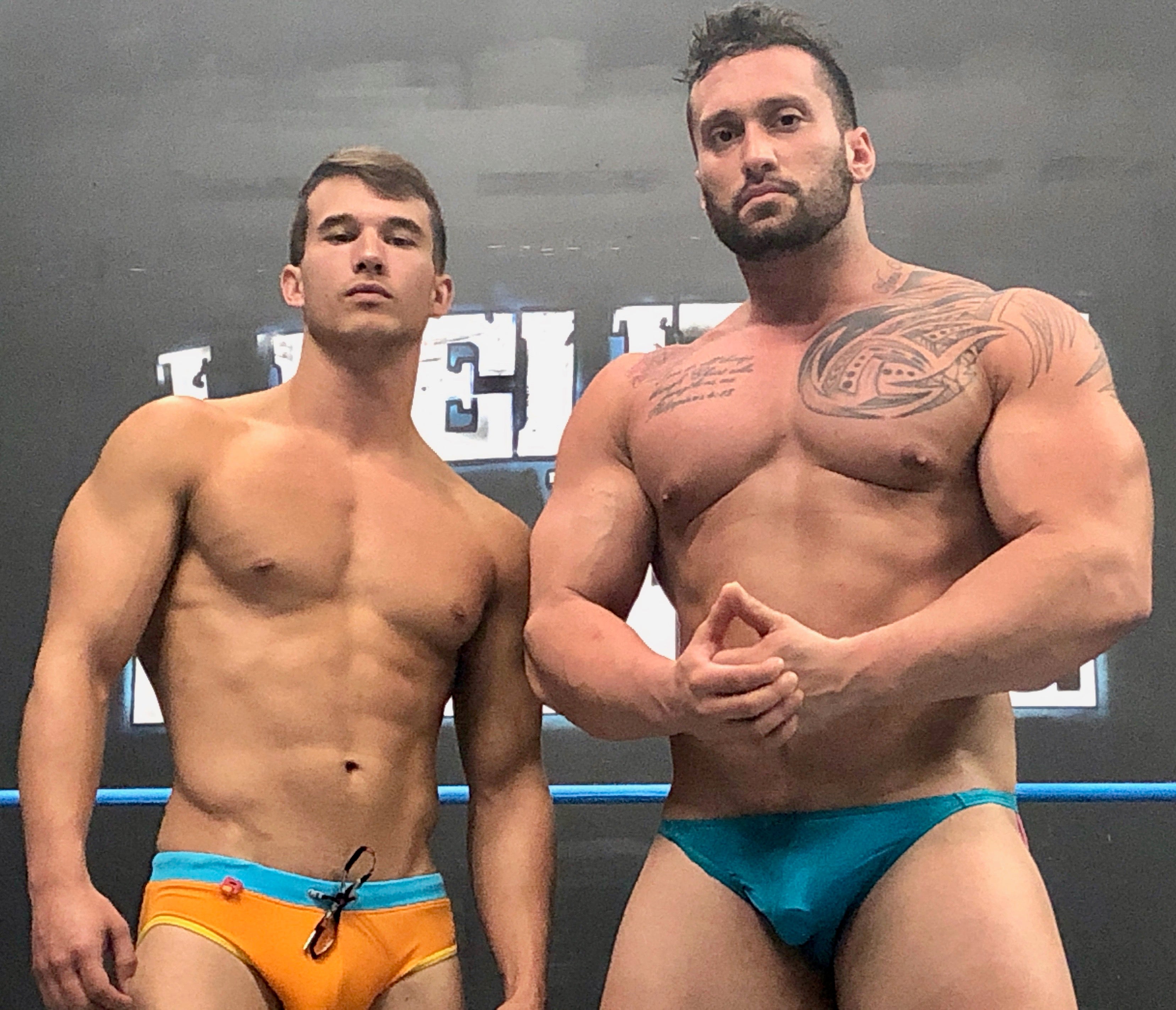 Kasee and Stallion flexing at Thunders Arena Wrestling. 