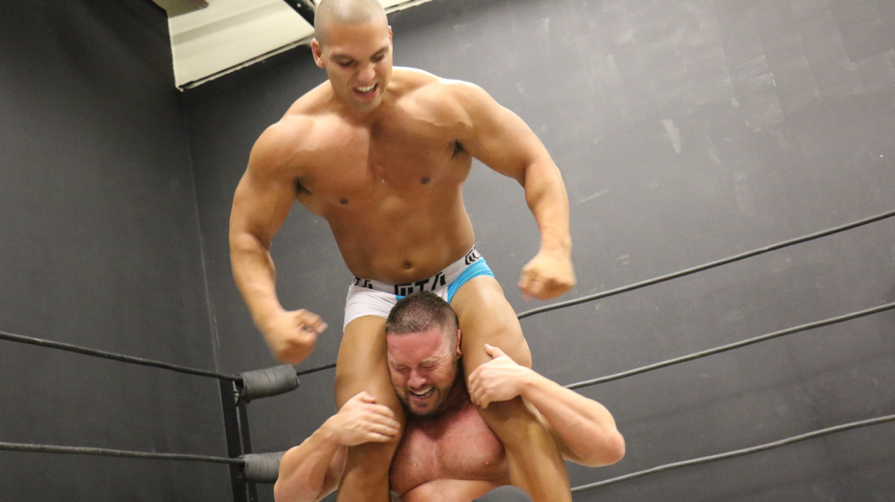 Dozer head scissors Joey King arms flexing pecs