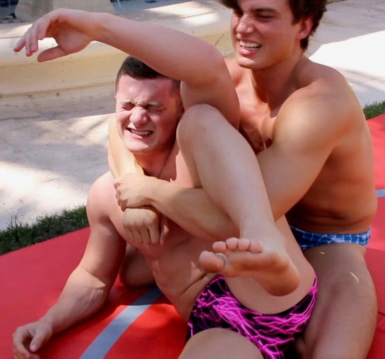 muscular guys pin each other