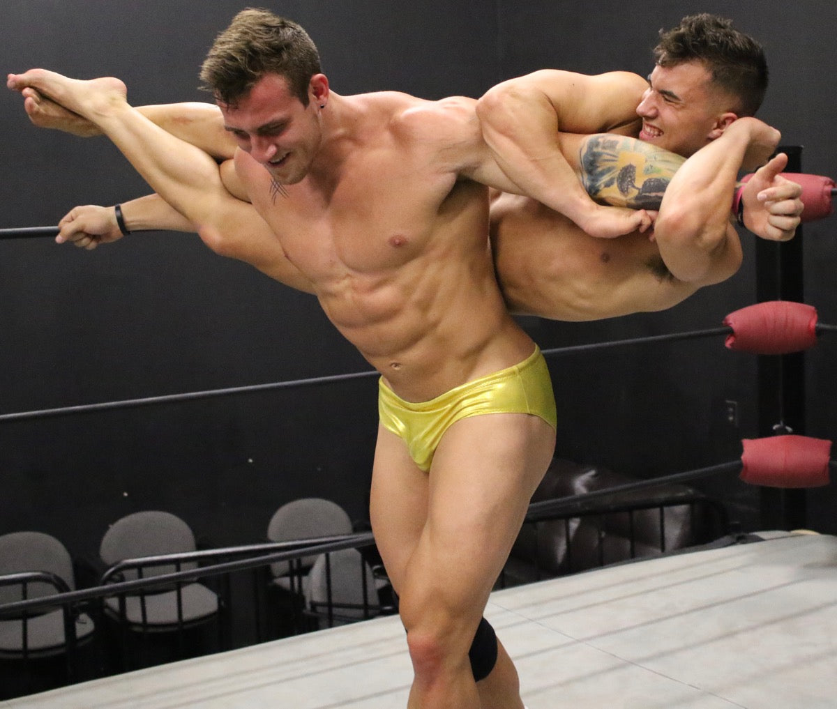 Cason carries Kasee across the ring at Thunders Arena Wrestling.