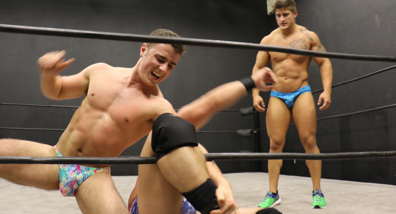 Eagle grapples Bucky in the ropes big pecs abs