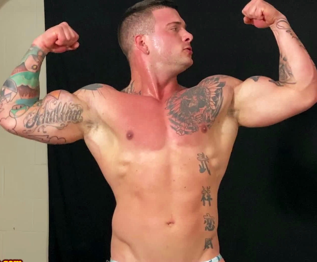 Hero flexes at Thunders Arena Wrestling. 