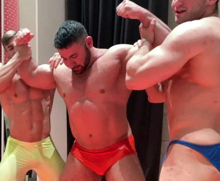 Gino flexes his biceps for Loki and Auswell at Thunders Arena Wrestling. 