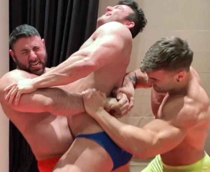 Gino puts Mercury into a bear hug at Thunders Arena Wrestling.