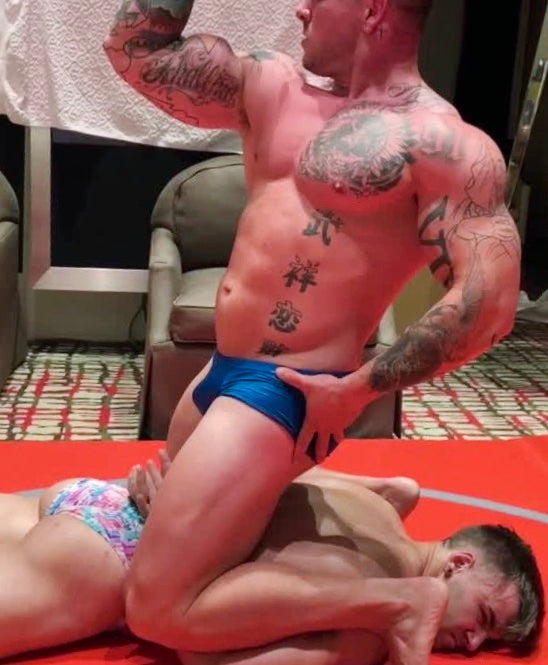 Hero flexes on top of Hero at Thunders Arena Wrestling. 