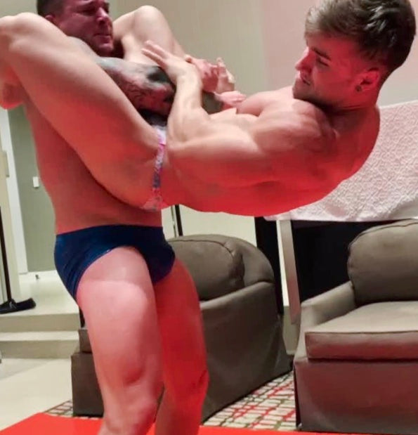 Hero lifts Loki at Thunders Arena Wrestling. 