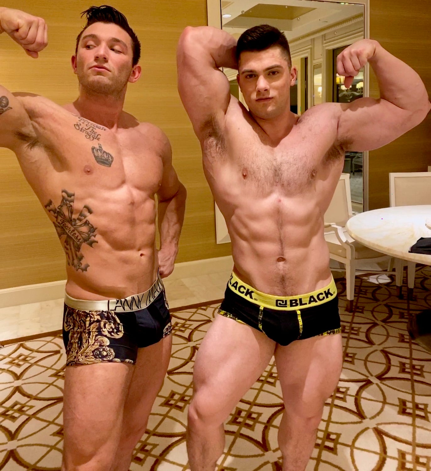 Mercury and Simpson flex their biceps at Thunders Arena Wrestling. 