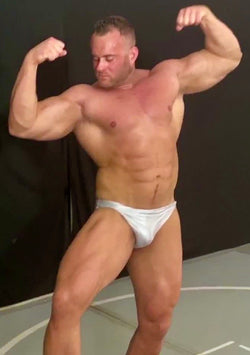 Mark Muscle flexing his biceps at Thunders Arena Wrestling. 