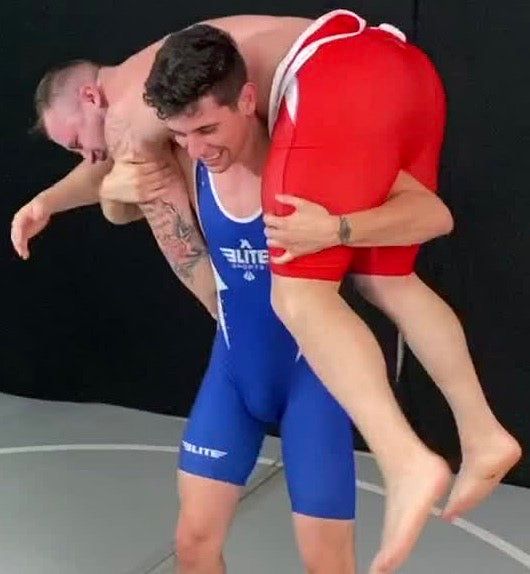 Flaco puts Dom Knight into a fireman’s carry at Thunders Arena Wrestling. 