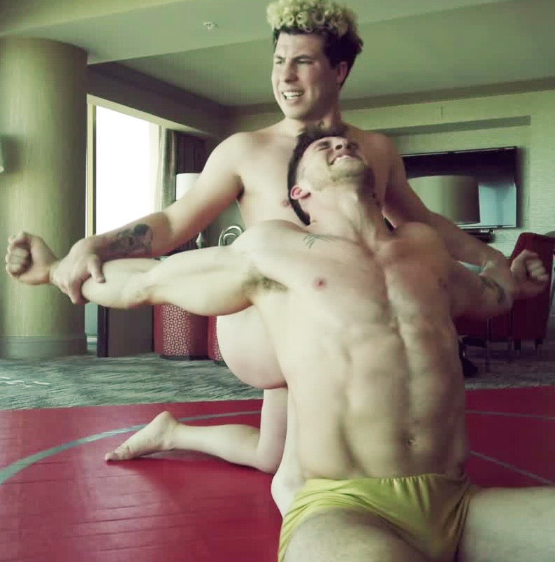 Axel stretching Cason out with a knee in his back