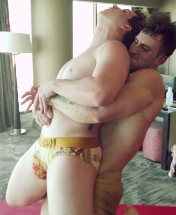 Cason bear hugging Axel from behind