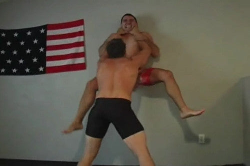 Ajax lifts and pins Dakota to wall choke carry arms