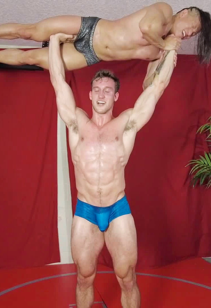 Cason holding Jessie above his head