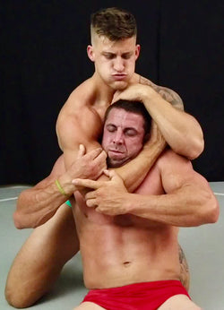 Eagle puts Cash into a head lock at Thunders Arena Wrestling. 