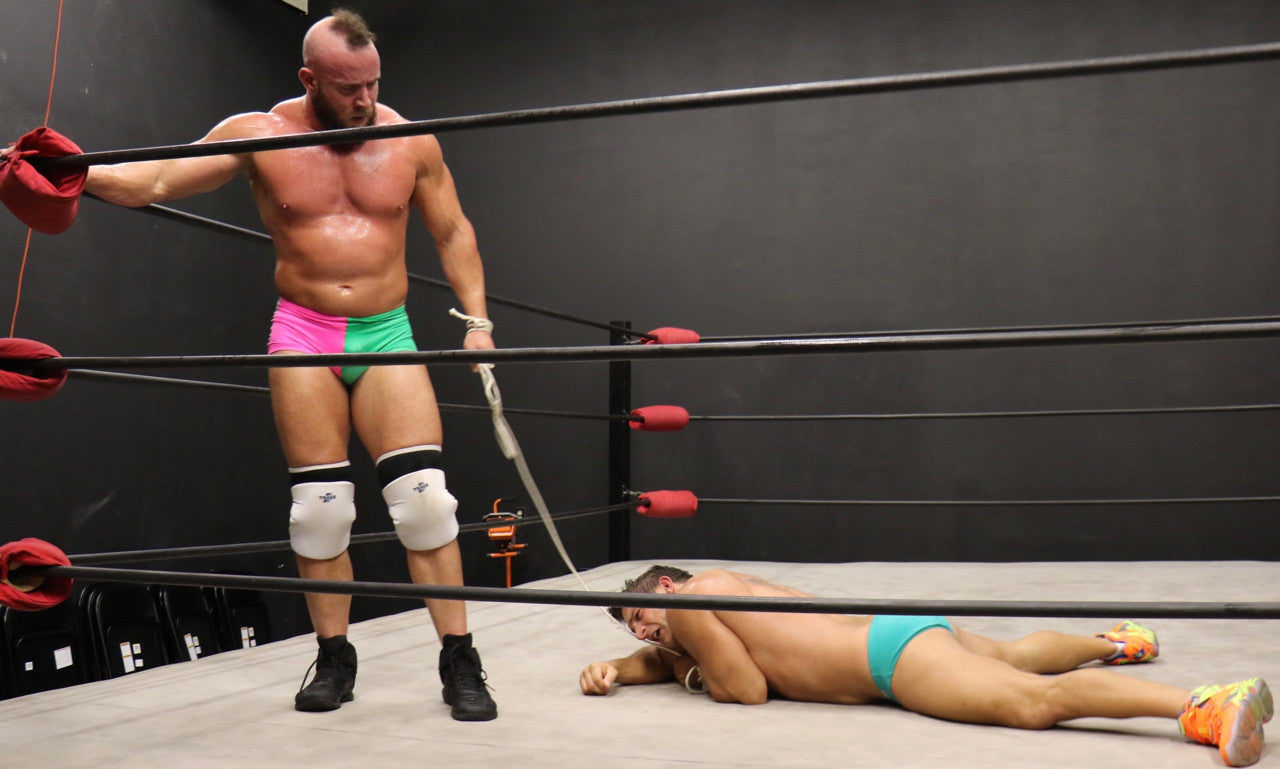 Brute stands over a defeated PeeWee pecs