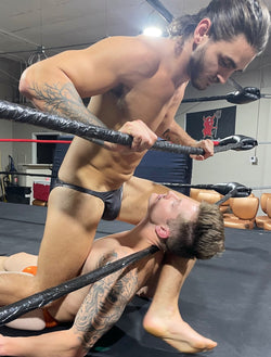 Wrestler puts crotch in opponents face