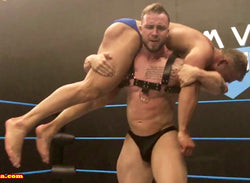 Dom Knight puts Jake into a fireman's carry at Thunders Arena Wrestling. 