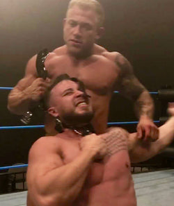 Jake puts Dom Knight into a sleeper at Thunders Arena Wrestling. 