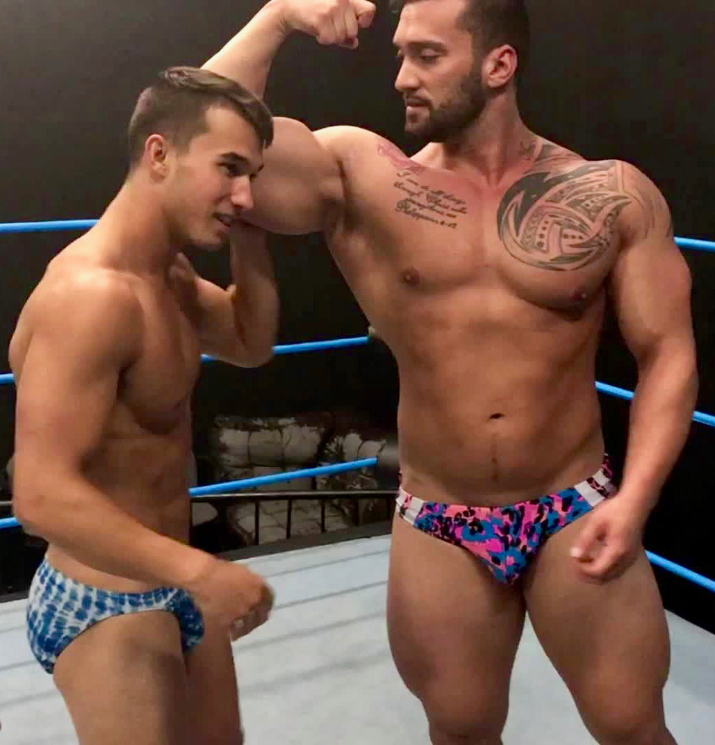 Kasee and Stallion flexing at Thunders Arena Wrestling. 