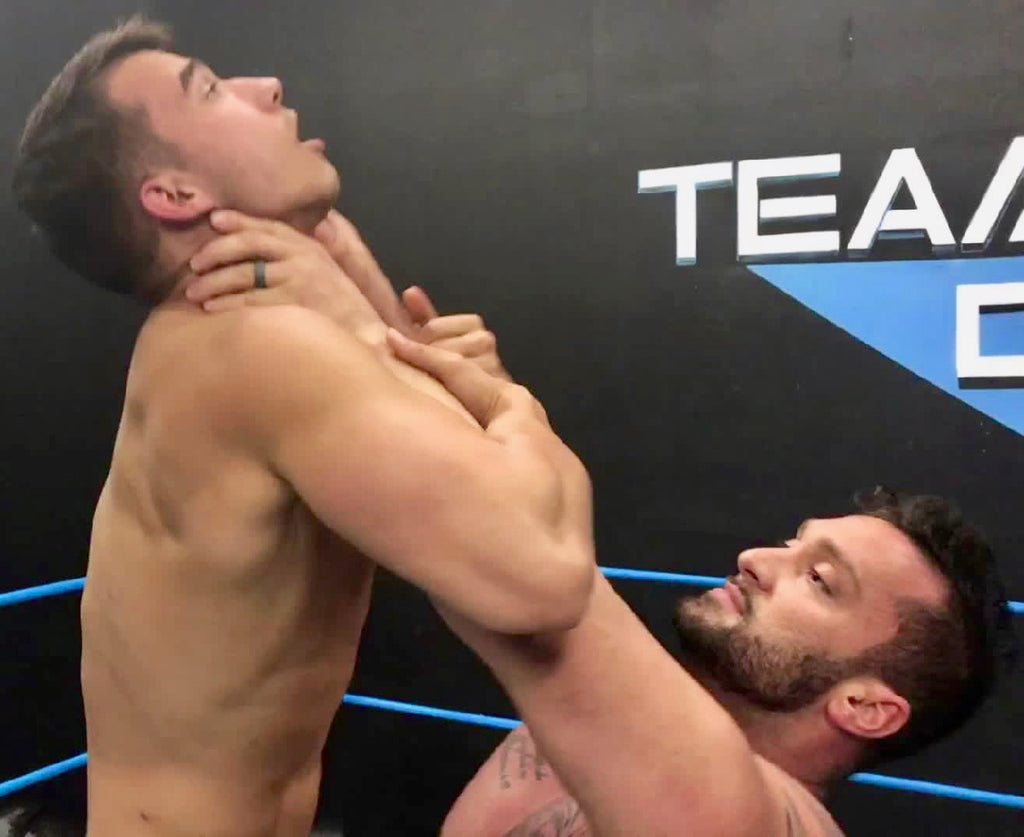 Stallion choke lifting Kasee at Thunders Arena Wrestling. 