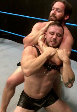 Joey King puts Dom Knight into a sleeper at Thunders Arena Wrestling. 