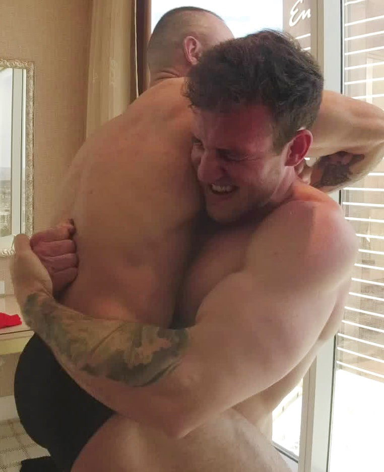 Cason bear hugging Caesar