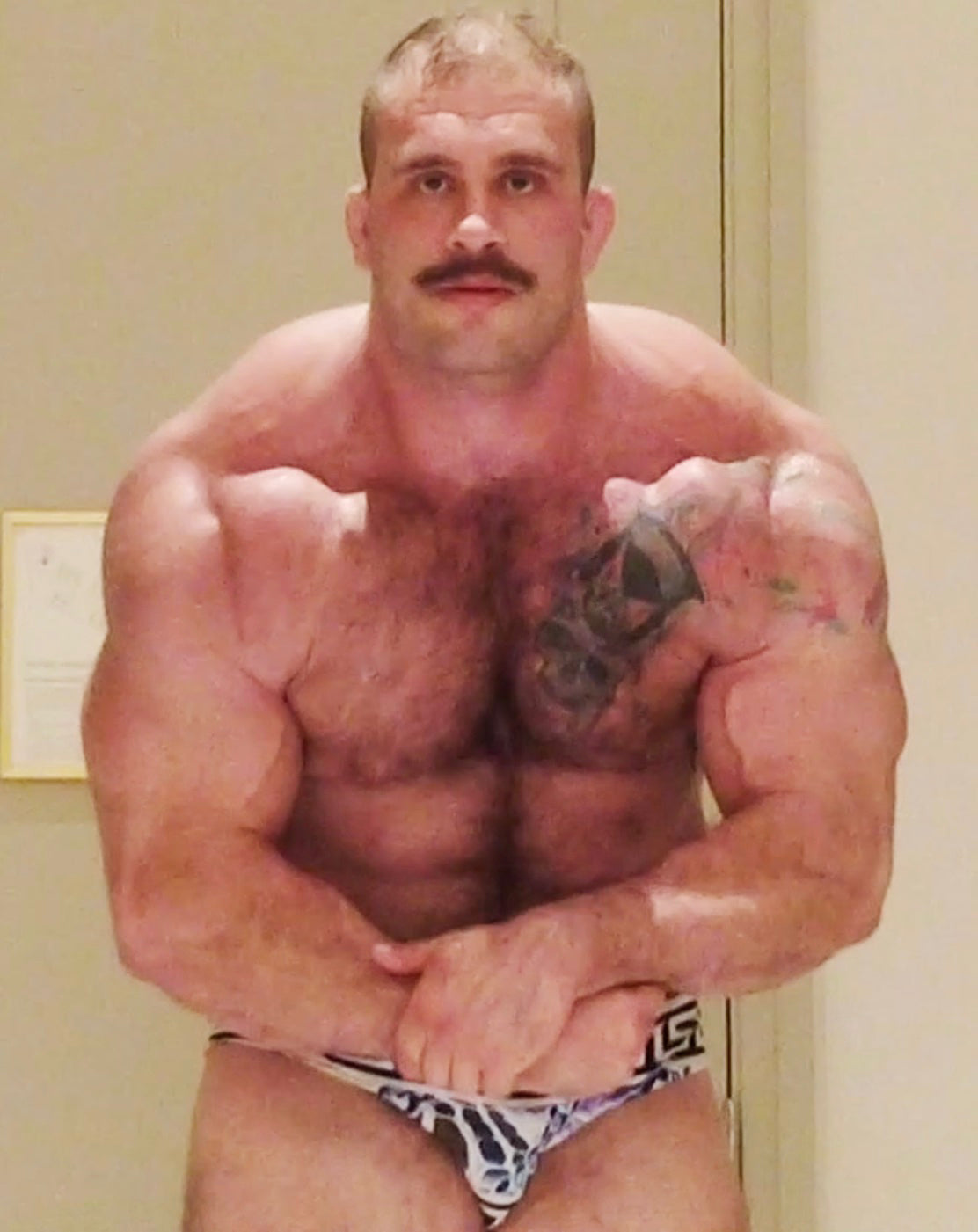 Davin flexing into the camera