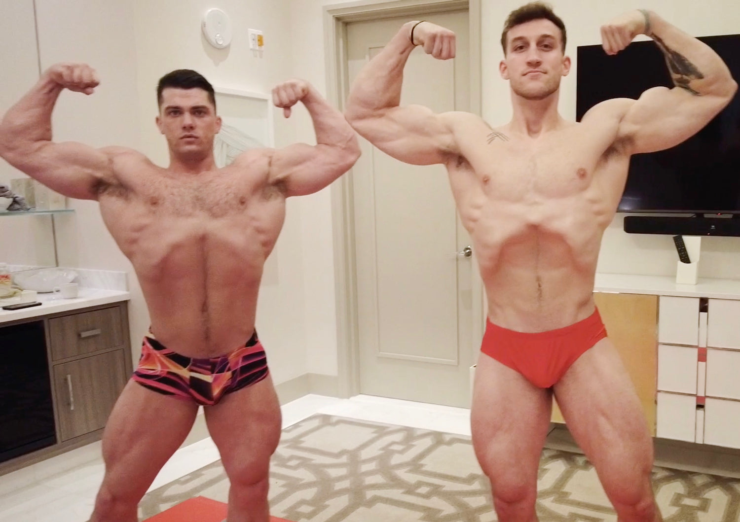 Simpson and Cason double bicep flexing