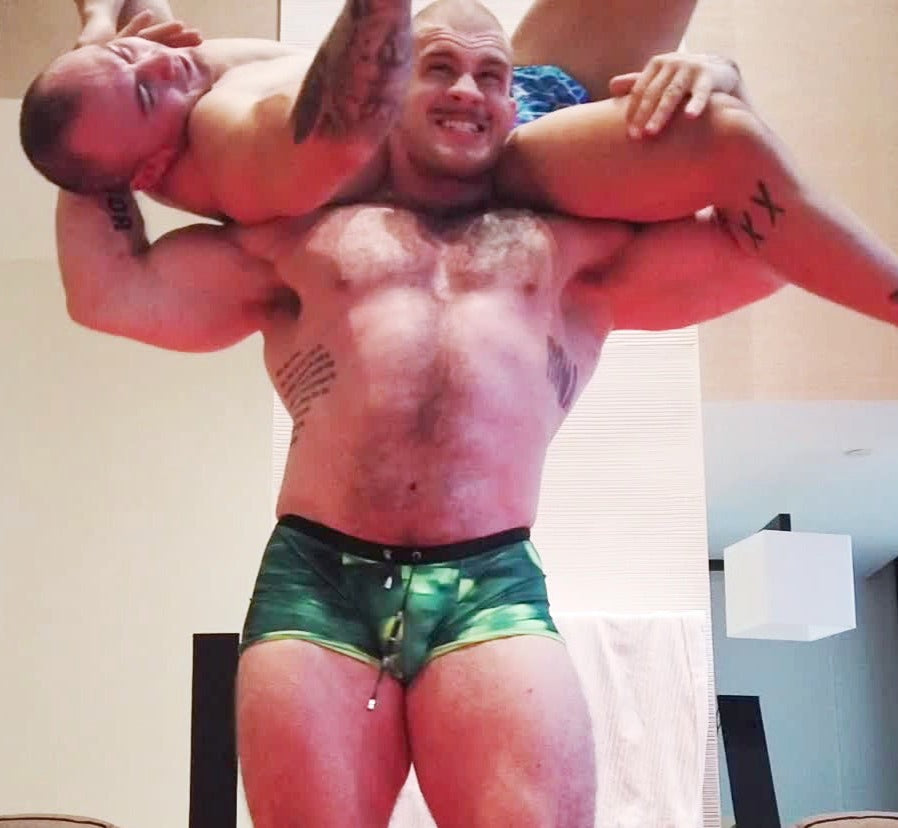 Davin holding Caesar in a torture rack