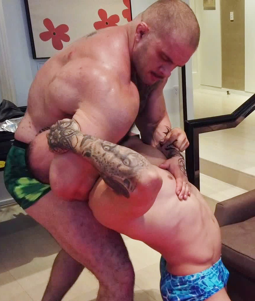 Davin holding Caesar in a dragon sleeper