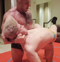 Davin holding Axel in an over the knee back breaker