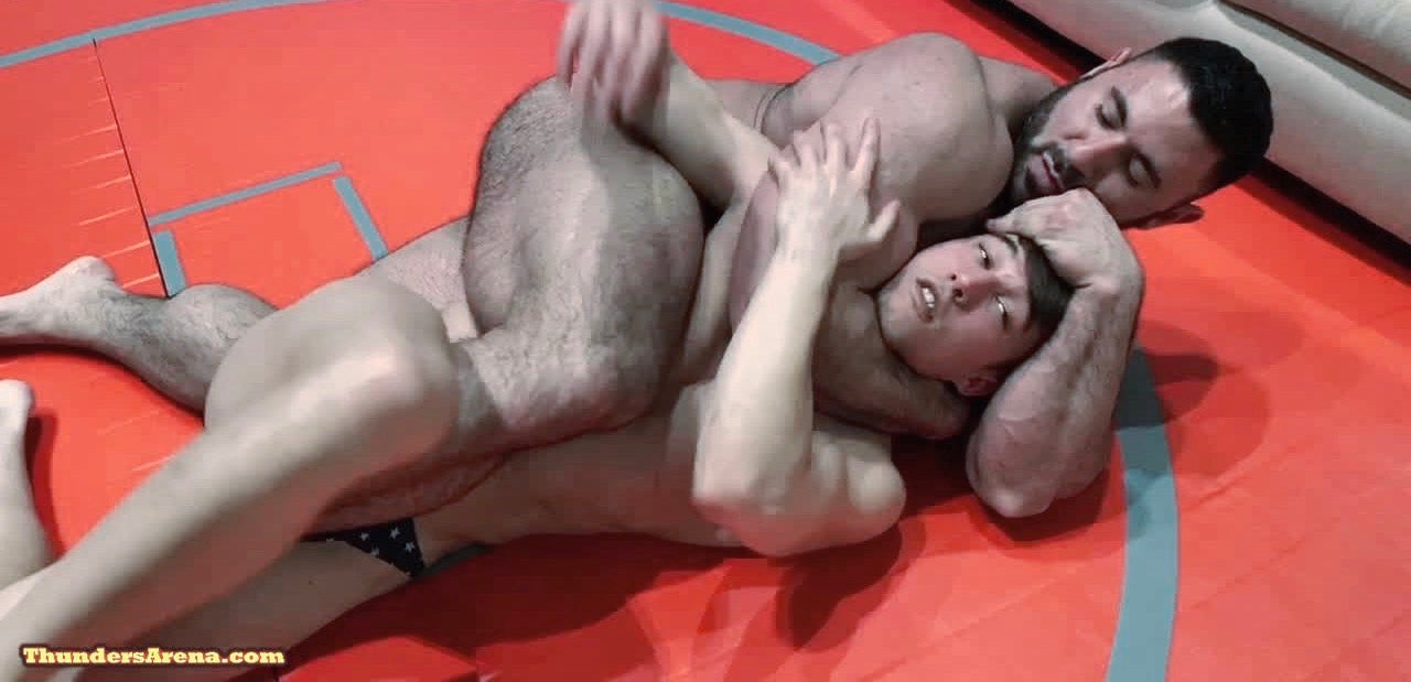 Gino puts KaSee into a body scissors at Thunders Arena Wrestling. 