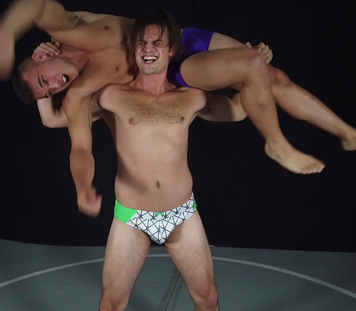 Van Acker puts Kasee into a fireman's carry at Thunders Arena Wrestling. 