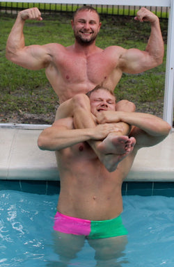 Meaty head scissoring Regan while flexing