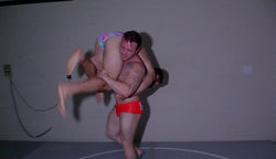 Dom9 carries Blayne around the mat at Thudners Arena Wrestling. 