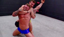 Cason puts Gunner into a chokehold at Thunders Arena Wrestling. 