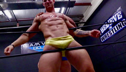  muscular guy being pinned on ropes