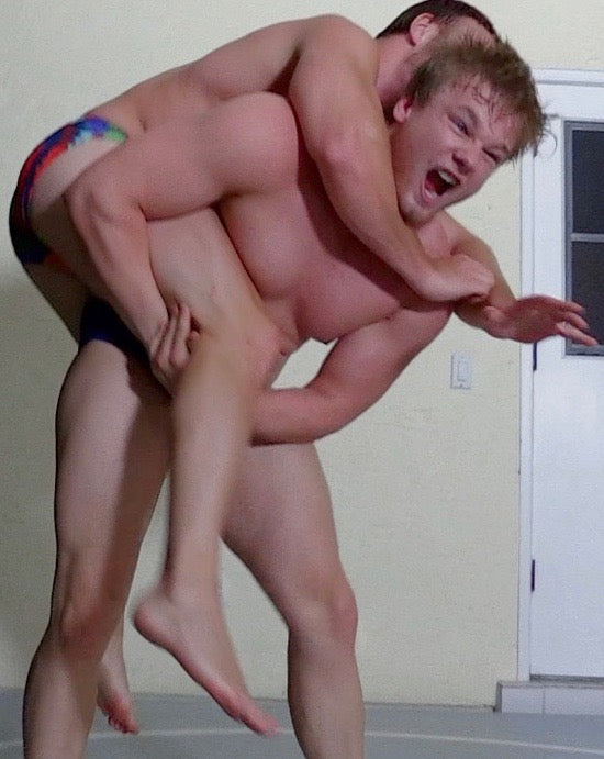 muscular men wrestling